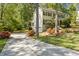 Long driveway leading to a house with basketball hoop and lush landscaping at 2441 Mitchell Ne Rd, Marietta, GA 30062
