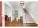 Inviting foyer with hardwood floors, a staircase, and a view into the living room at 2441 Mitchell Ne Rd, Marietta, GA 30062