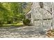 Two-car garage with a basketball hoop, screened porch and a well-maintained lawn at 2441 Mitchell Ne Rd, Marietta, GA 30062