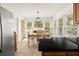Sunny eat-in kitchen featuring a wooden dining table and backyard view at 2441 Mitchell Ne Rd, Marietta, GA 30062