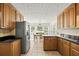 Kitchen with wooden cabinets, granite countertops, and stainless steel appliances at 2441 Mitchell Ne Rd, Marietta, GA 30062