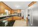 Kitchen with granite countertops, stainless steel appliances, and wooden cabinets at 2441 Mitchell Ne Rd, Marietta, GA 30062