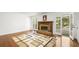 Bright living room with a brick fireplace and large glass doors to the outside at 2441 Mitchell Ne Rd, Marietta, GA 30062