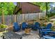 Backyard patio area with Adirondack chairs, stone firepit and privacy fence at 3603 Allpoint Dr, Marietta, GA 30062