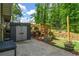 Well-maintained backyard with storage shed, chicken coop, garden beds and patio at 3603 Allpoint Dr, Marietta, GA 30062