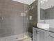 Modern bathroom showcasing a glass enclosed walk-in shower with pebble flooring and a vessel sink vanity at 3603 Allpoint Dr, Marietta, GA 30062