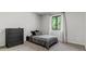 Bedroom featuring a dark dresser, window view, neutral walls at 3603 Allpoint Dr, Marietta, GA 30062