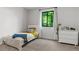 Cozy bedroom with a window view, neutral colors and dresser at 3603 Allpoint Dr, Marietta, GA 30062