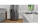 Kitchen features stainless steel refrigerator, white cabinets, subway tile, and quartz countertops at 3603 Allpoint Dr, Marietta, GA 30062