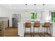 Bright, white kitchen featuring a large island, stainless steel appliances, and modern pendant lighting at 3603 Allpoint Dr, Marietta, GA 30062
