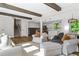 Open-concept living space with hardwood floors, a large window and easy access to the kitchen at 3603 Allpoint Dr, Marietta, GA 30062
