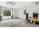 Bright office area features large window with scenic views, desk, and overhead ceiling fan at 3603 Allpoint Dr, Marietta, GA 30062