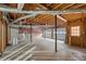 Unfinished basement with visible ducts, door to outside, and garage door, ready for customization at 503 Pinehurst Ln, Woodstock, GA 30188