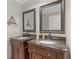 Bathroom featuring and sinks with dark wood cabinets and granite countertops at 503 Pinehurst Ln, Woodstock, GA 30188