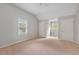 A carpeted bedroom has two windows and two closets at 503 Pinehurst Ln, Woodstock, GA 30188