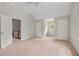 Large bedroom with neutral walls and multiple closets at 503 Pinehurst Ln, Woodstock, GA 30188