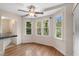 An eat-in dining nook with views of backyard through bay windows at 503 Pinehurst Ln, Woodstock, GA 30188