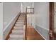 Bright foyer with hardwood floors and a staircase to the second floor at 503 Pinehurst Ln, Woodstock, GA 30188