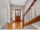 Welcoming foyer featuring a beautiful front door and hardwood floors at 503 Pinehurst Ln, Woodstock, GA 30188