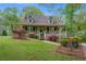 Charming home with a large front porch and beautiful landscaping at 503 Pinehurst Ln, Woodstock, GA 30188