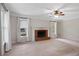 Spacious living room with a brick fireplace and large windows at 503 Pinehurst Ln, Woodstock, GA 30188