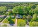Home featuring a well-manicured front lawn, mature trees, and a serene neighborhood setting at 1153 Chatsworth Dr, Avondale Estates, GA 30002