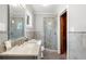 Elegant bathroom featuring marble walls, frameless glass shower, and a vanity with marble countertop at 1153 Chatsworth Dr, Avondale Estates, GA 30002