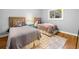 Bedroom featuring hardwood floors, natural light, and two twin beds with coordinated decor at 1153 Chatsworth Dr, Avondale Estates, GA 30002