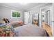 Shared bedroom with hardwood floors, a view to the bath, and ample space at 1153 Chatsworth Dr, Avondale Estates, GA 30002