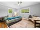 Cozy bedroom with hardwood floors, neutral paint, and ample natural light from the two windows at 1153 Chatsworth Dr, Avondale Estates, GA 30002