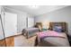 Well-lit bedroom with hardwood floors, two twin beds, and neutral wall color at 1153 Chatsworth Dr, Avondale Estates, GA 30002