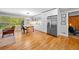 Bright eat-in kitchen featuring hardwood floors, stainless steel appliances, and large windows offering scenic views at 1153 Chatsworth Dr, Avondale Estates, GA 30002
