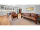 Stylish living room featuring hardwood floors and a modern kitchen with stainless steel appliances at 1153 Chatsworth Dr, Avondale Estates, GA 30002