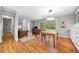 Cozy living room with hardwood floors that flows into an eat-in kitchen area, perfect for entertaining at 1153 Chatsworth Dr, Avondale Estates, GA 30002