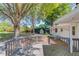 Backyard with lush, mature trees and wooden patio at 1312 Harbins Rd, Dacula, GA 30019