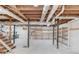 Unfinished basement with wooden shelving at 1312 Harbins Rd, Dacula, GA 30019