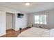Clean bedroom featuring a TV, window, and a full-sized bed at 1312 Harbins Rd, Dacula, GA 30019