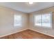 Bright bedroom with hardwood floors and sunny windows at 1312 Harbins Rd, Dacula, GA 30019