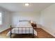Cozy bedroom with wood flooring and shiplap accent wall at 1312 Harbins Rd, Dacula, GA 30019