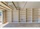 A clean garage with built-in white shelving along the entire back wall at 1312 Harbins Rd, Dacula, GA 30019