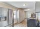 Spacious laundry room with stainless steel appliances, ample storage and lots of natural light at 1312 Harbins Rd, Dacula, GA 30019