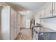 Bright laundry room with storage cabinets, and modern washer and dryer units at 1312 Harbins Rd, Dacula, GA 30019