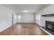 Living room with hardwood floors, fireplace and views to the exterior at 1312 Harbins Rd, Dacula, GA 30019