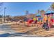 Vibrant playground with climbing structures and slides in a Gathering-friendly community park at 1312 Harbins Rd, Dacula, GA 30019