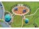 Aerial view of a well-equipped playground surrounded by green lawns and walking paths at 1312 Harbins Rd, Dacula, GA 30019