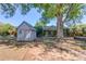 Exterior view of the backyard shed with a canopy, providing extra storage space at 1312 Harbins Rd, Dacula, GA 30019