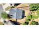 Aerial view shows the layout of the home, its backyard with a small garden, and surrounding trees at 2525 Ashton Dr, Roswell, GA 30076