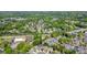 Wide aerial shot displaying the house within a tranquil, tree-filled suburban community at 2525 Ashton Dr, Roswell, GA 30076