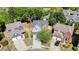 Aerial view showcasing the home's location within a well-maintained neighborhood, surrounded by lush trees and green spaces at 2525 Ashton Dr, Roswell, GA 30076