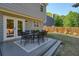 Inviting backyard deck with outdoor seating and a view of the well-maintained, fenced yard at 2525 Ashton Dr, Roswell, GA 30076